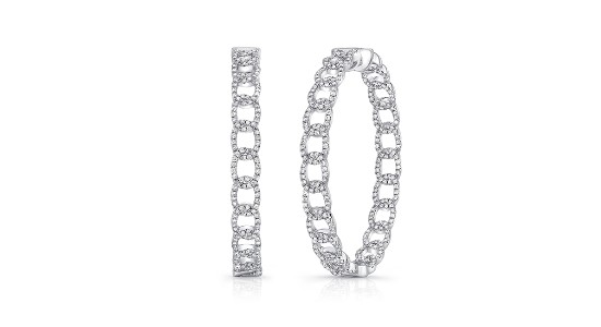 A pair of silver hoop earrings with diamond accents