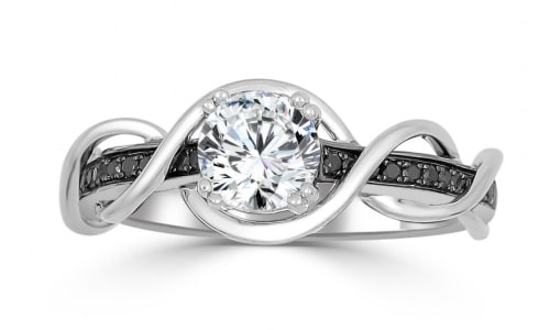 An engagement ring with a round cut diamond, black diamonds, and an interweaving band accent.