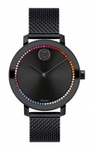 A black watch from Movado Bold with an array of colorful gems framing the dial.