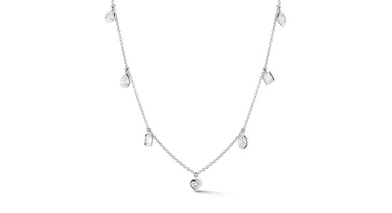 a white gold station necklace featuring different diamond cuts.