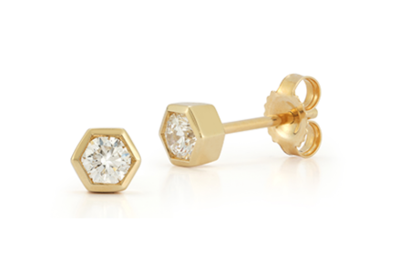 A pair of minimalist bezel stud earrings from Beny Sofer, available at Michael Agnello Jewelers.